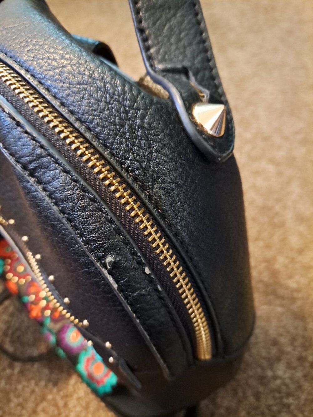 Black Steve Madden embroidered floral backpack with gold hardware. - Picture 5 of 13